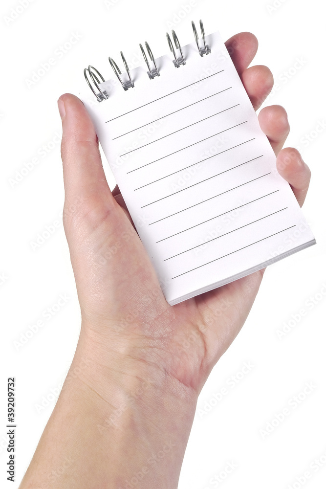 hand holding open empty lined pad - white background hand holding open empty lined pad - white background