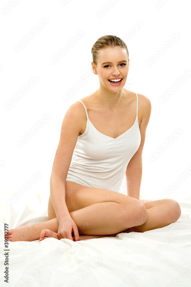 Young Woman in Underwear Sitting on Bed