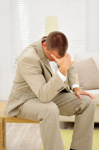 Employee thinking about mistakes in his job