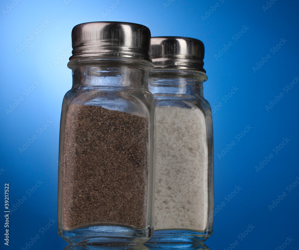 Salt and pepper mills on blue Salt and pepper mills on blue