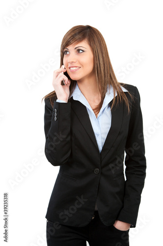 Young woman talking on cell phone isolated