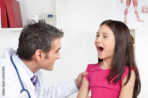Doctor Examining a Child Mouth