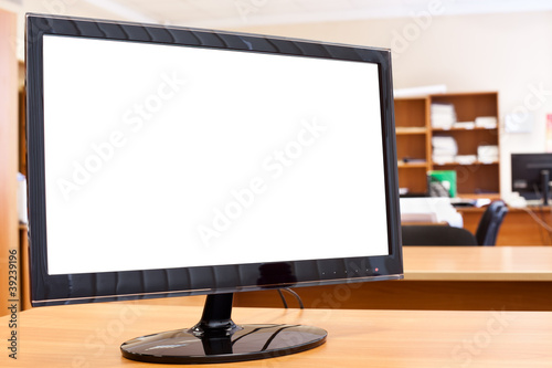 Computer monitor with isolated screen on desktop in office room