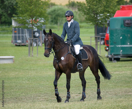 Rider on his horse going to start of showjumping