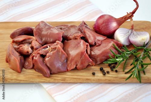 Raw liver on wooden board