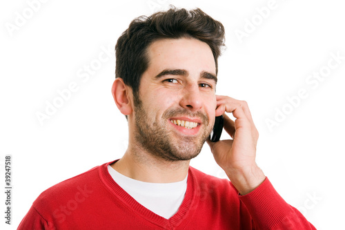 Handsome man portrait talking at the cell phone isolated on whit