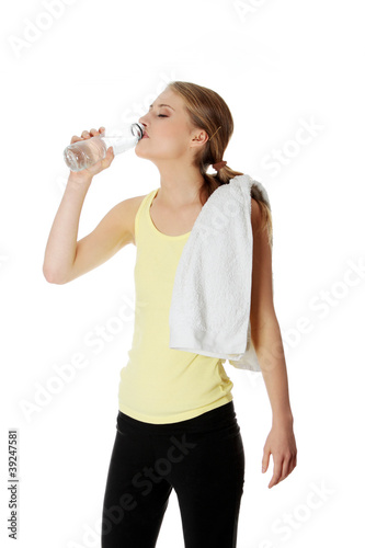 Young girl with bottle of mineral water