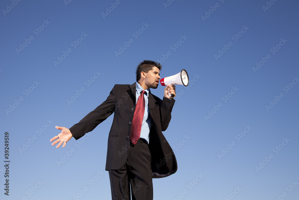 Businessman speaking with a megaphone Businessman speaking with a megaphone