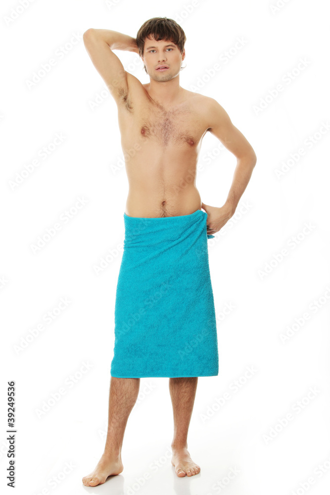 Fototapeta premium Handsome young man with the towel.