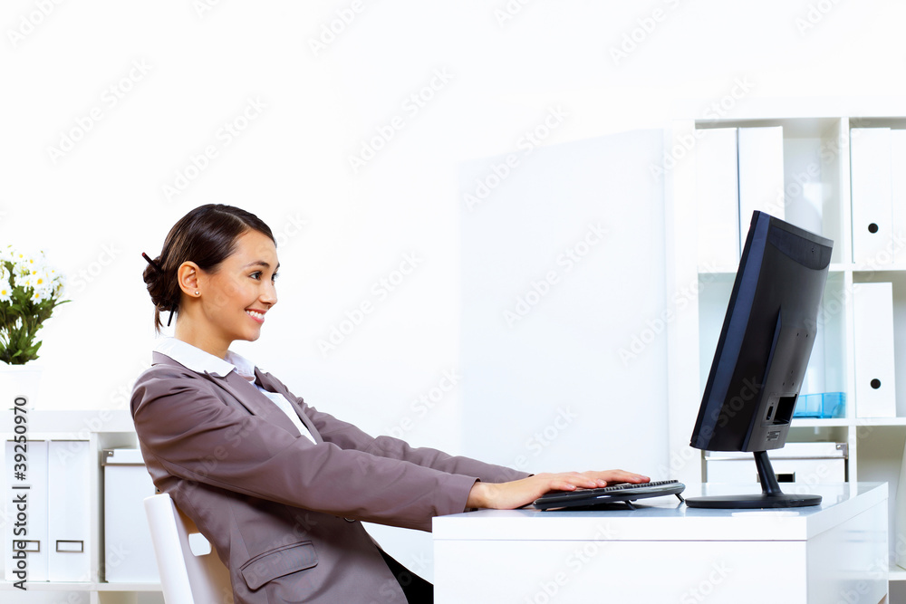 Young woman in business wear working in office Young woman in business wear working in office
