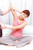 young woman getting a thai massage