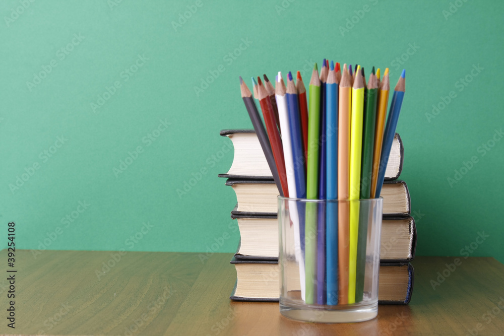 books and pencils on the desk books and pencils on the desk