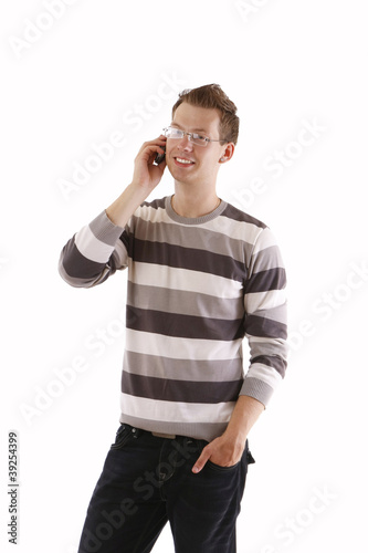 a young man talking on a cell phone