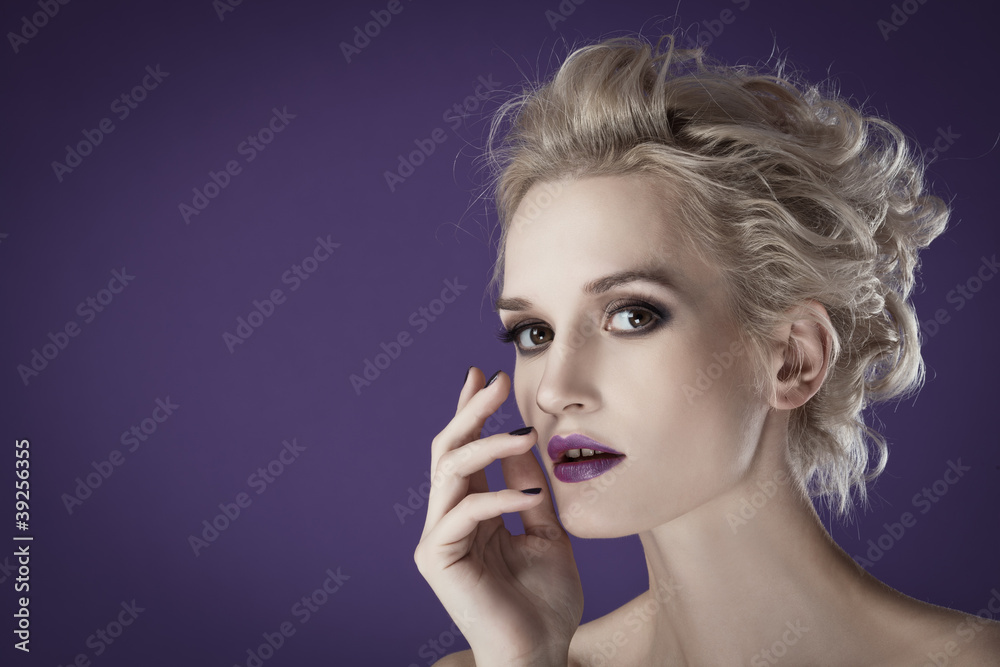 The image of a beautiful luxurious woman on purple background. S The image of a beautiful luxurious woman on purple background. S