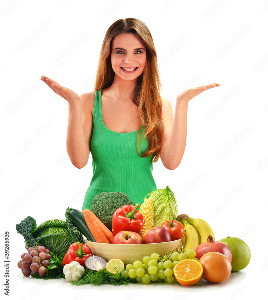 Young smiling woman with variety of fresh vegetables and fruits Young smiling woman with variety of fresh vegetables and fruits
