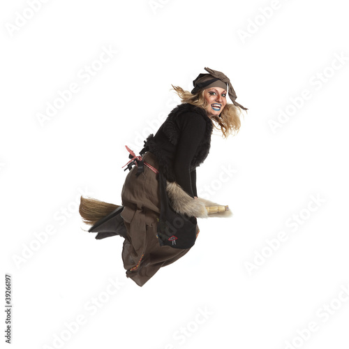 Young woman witch fly on broom