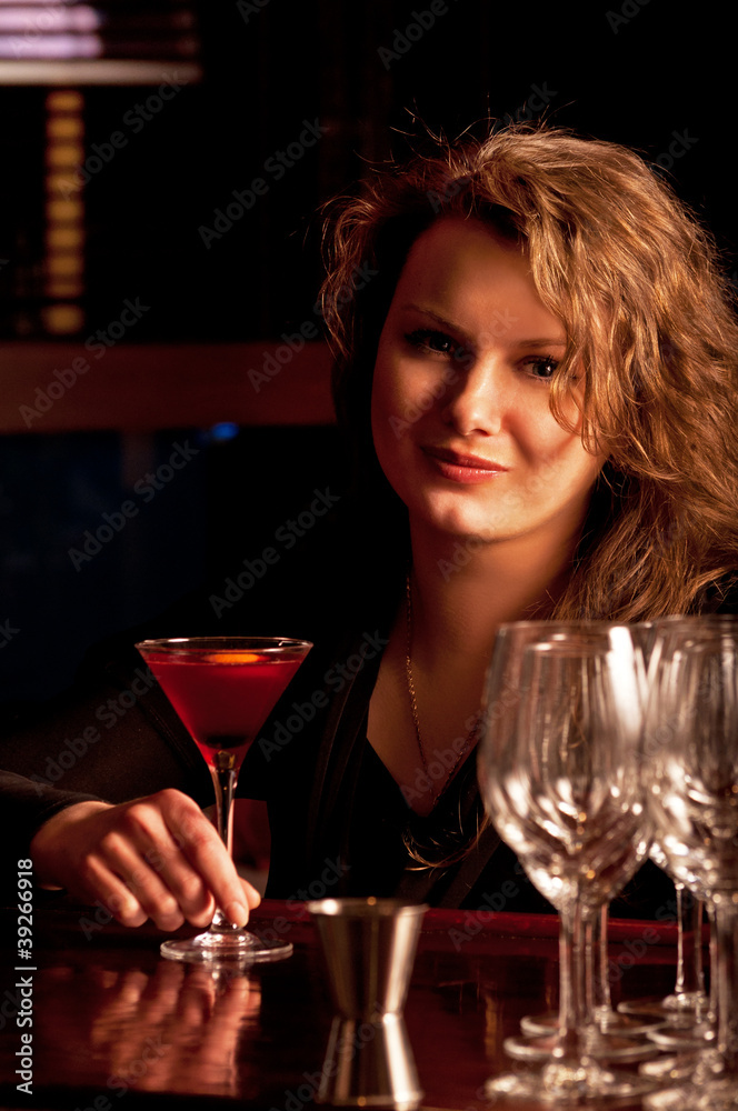 Beautiful woman at the cocktail bar