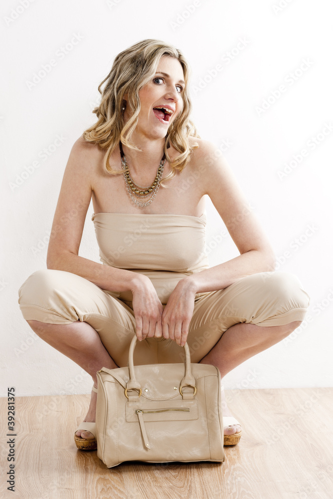 woman wearing summer clothes with handbag woman wearing summer clothes with handbag