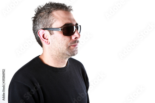 Portrait of a stylish young man over white background © Nenov Brothers