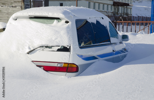 Snow covered car in the snowdrift after cyclone © Konstantin Shevtsov