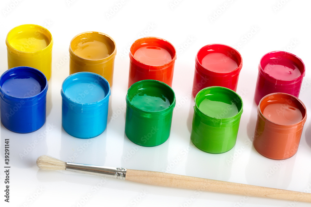 Paint buckets with paintbrush over white background Paint buckets with paintbrush over white background