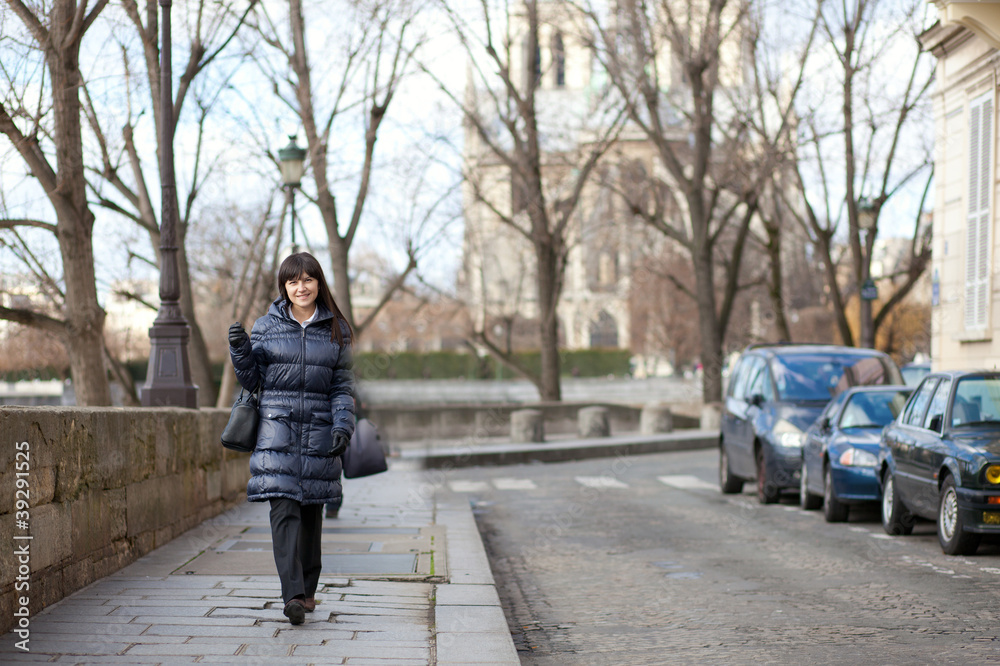 Pretty brunette female tourist walking in Paris Pretty brunette female tourist walking in Paris