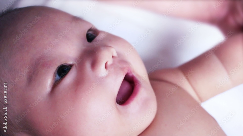A cute little baby looking and playing with father. A cute little baby looking and playing with father.