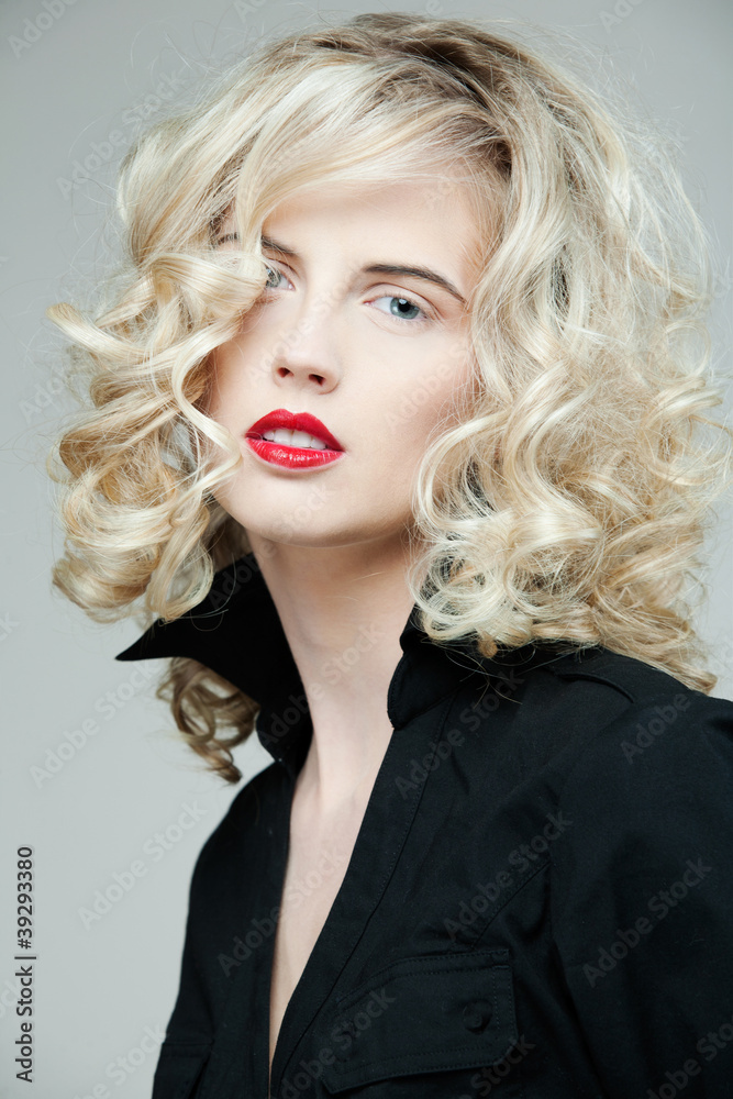 Beautiful woman with long curly blond hair. Beautiful woman with long curly blond hair.