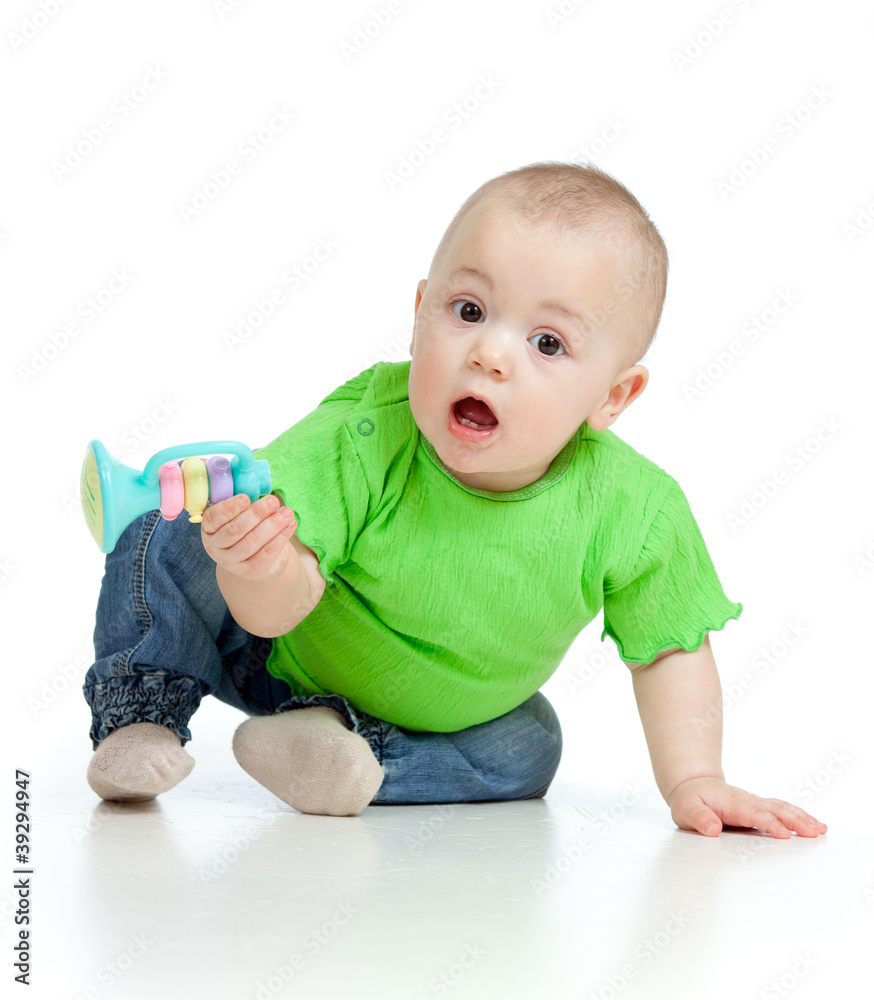 Funny baby with musical toy. Isolated on white background Funny baby with musical toy. Isolated on white background