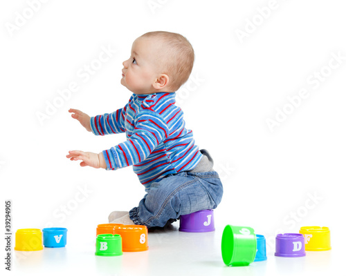 Funny little child is playi...