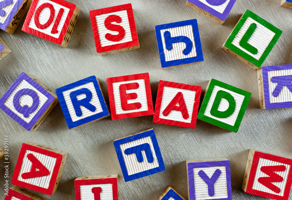 Wooden blocks forming the word READ in the center Wooden blocks forming the word READ in the center