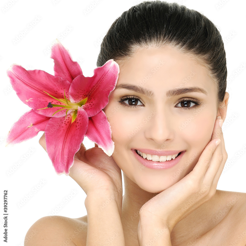 Young girl holding flower in her hands Young girl holding flower in her hands