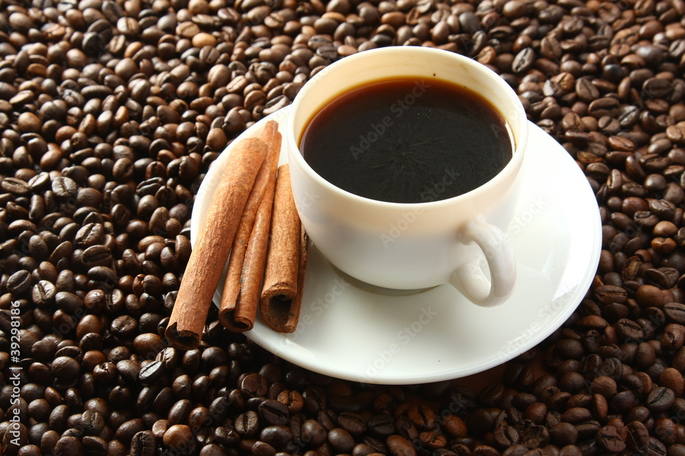 Fototapeta premium a cup of coffee and coffee beans