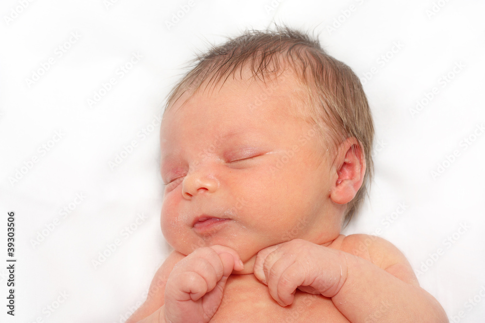 Sleeping Newborn Baby Boy on a White Blanket Sleeping Newborn Baby Boy on a White Blanket