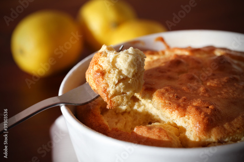 Mouthful of cheese soufflé on a fork, eating photo