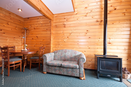 Lodge apartment interior with fireplace
