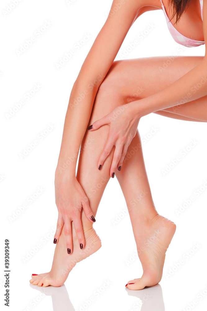 Long female legs against white background Long female legs against white background