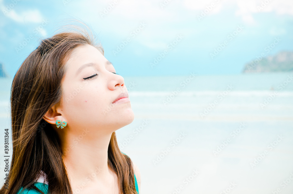 Attractive Asian woman enjoy on the beach