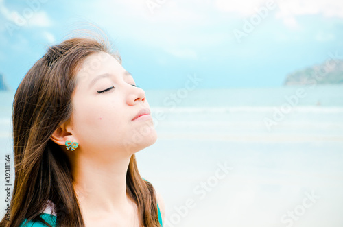 Attractive Asian woman enjoy on the beach