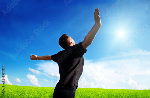 young man rest on spring field