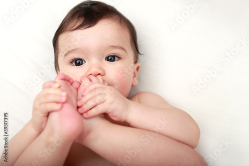 Baby sucking his toes