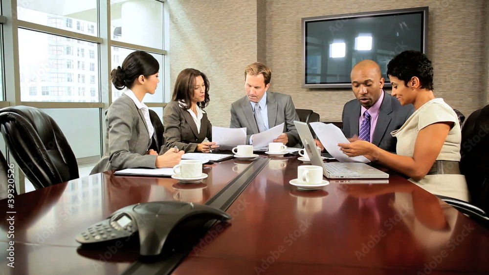 Multi Ethnic Business Team Meeting in Boardroom Multi Ethnic Business Team Meeting in Boardroom