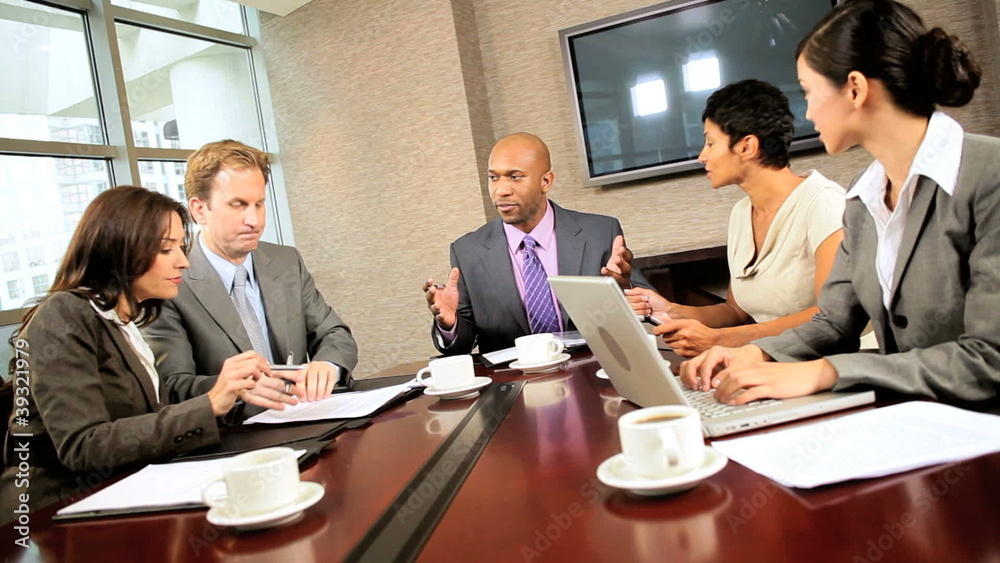 Ambitious Multi Ethnic Business Team in Boardroom Ambitious Multi Ethnic Business Team in Boardroom