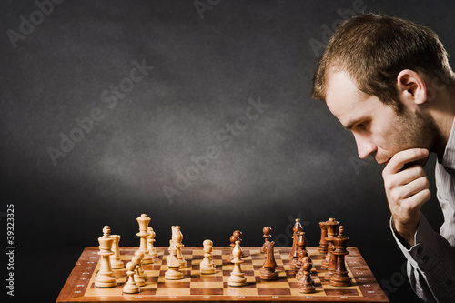 Man at chess board photo