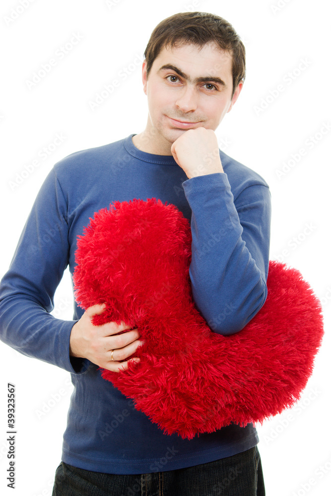 A man holding a big red heart on a white background. A man holding a big red heart on a white background.