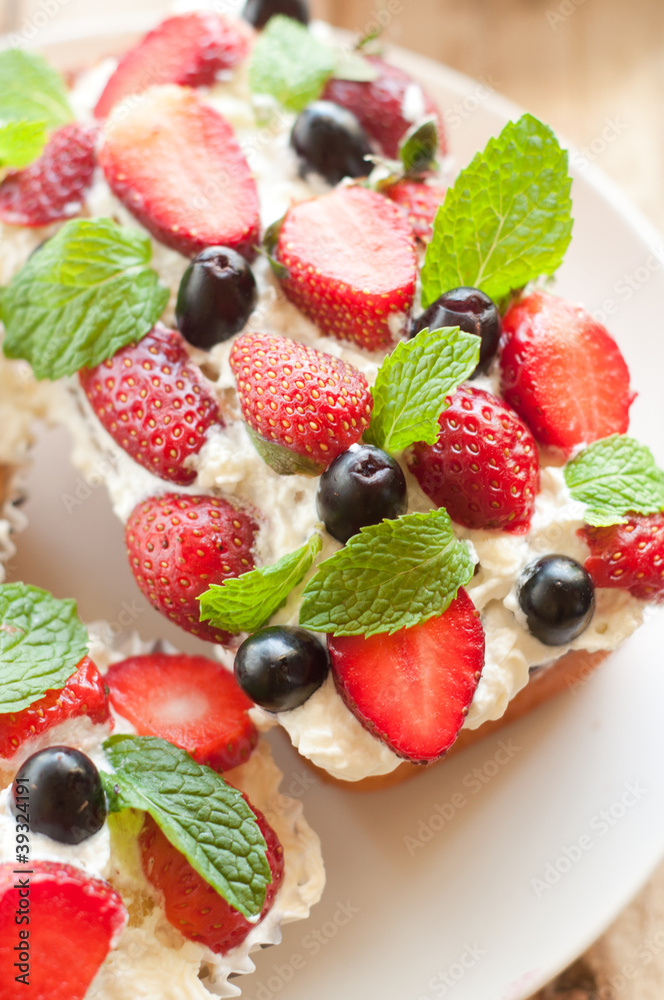 Lemon Pound Cake topped with whipped cream, fresh fruits Lemon Pound Cake topped with whipped cream, fresh fruits