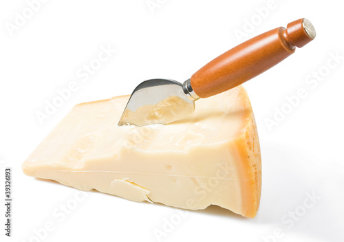 Parmesan cheese piece with knife.