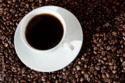 Cup of coffee on coffee. beans © pabijan