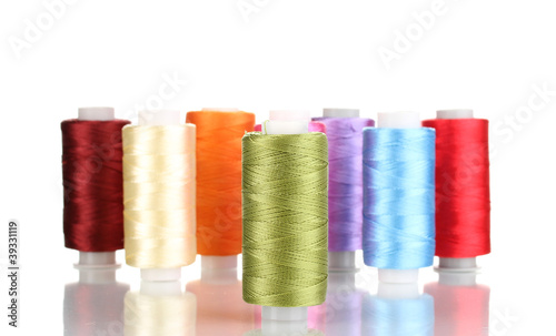 Many spools of thread isolated on white