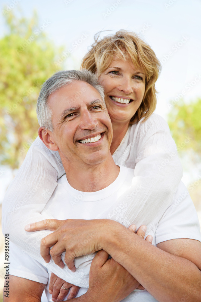 Mature couple smiling and embracing. Mature couple smiling and embracing.